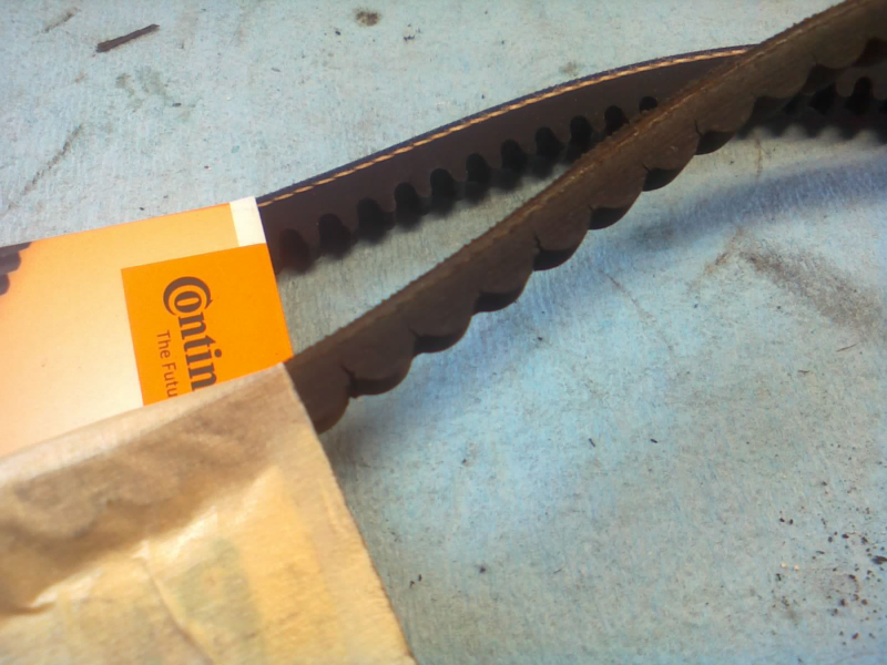 One of the old cracked belts vs new replacement